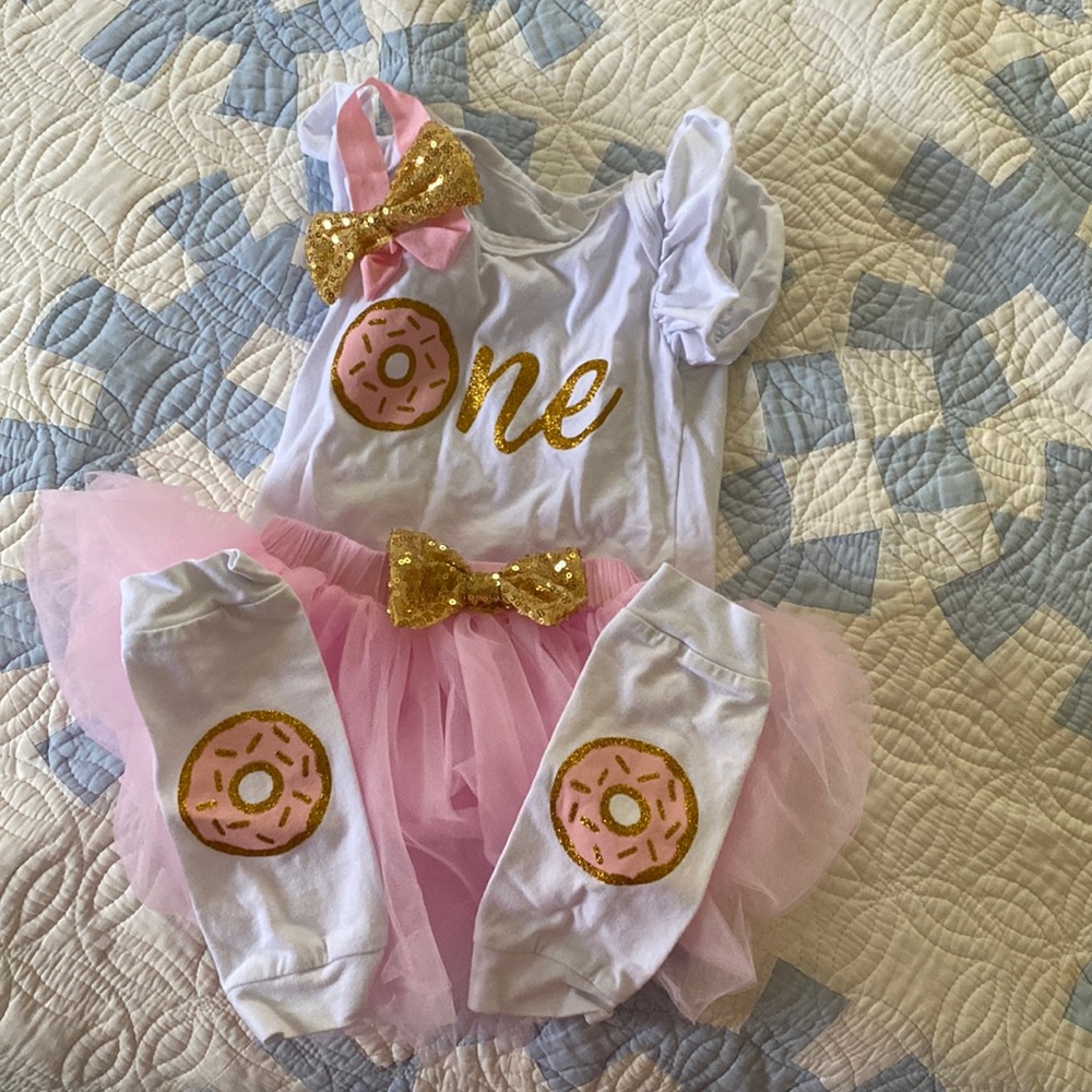 One year old donut onsie skirt leg warmers and headband.